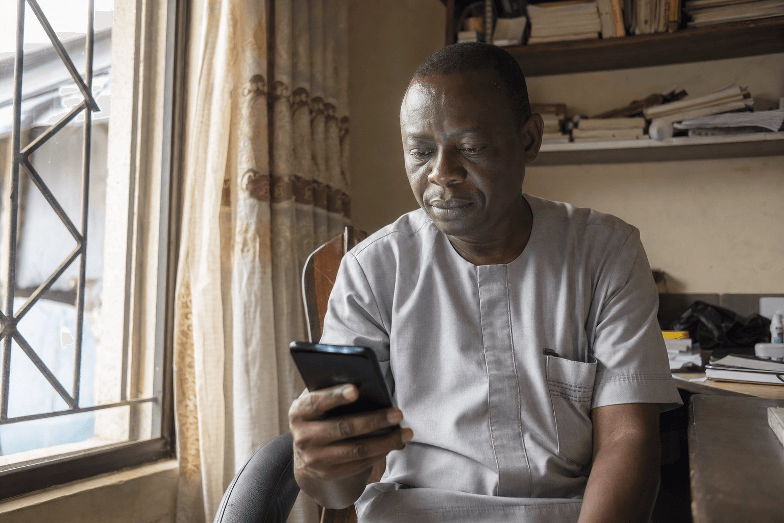 Landlord confirming a rent payment on a phone
